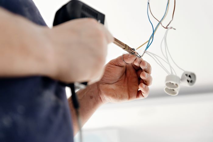 electrician fixing code violations in home